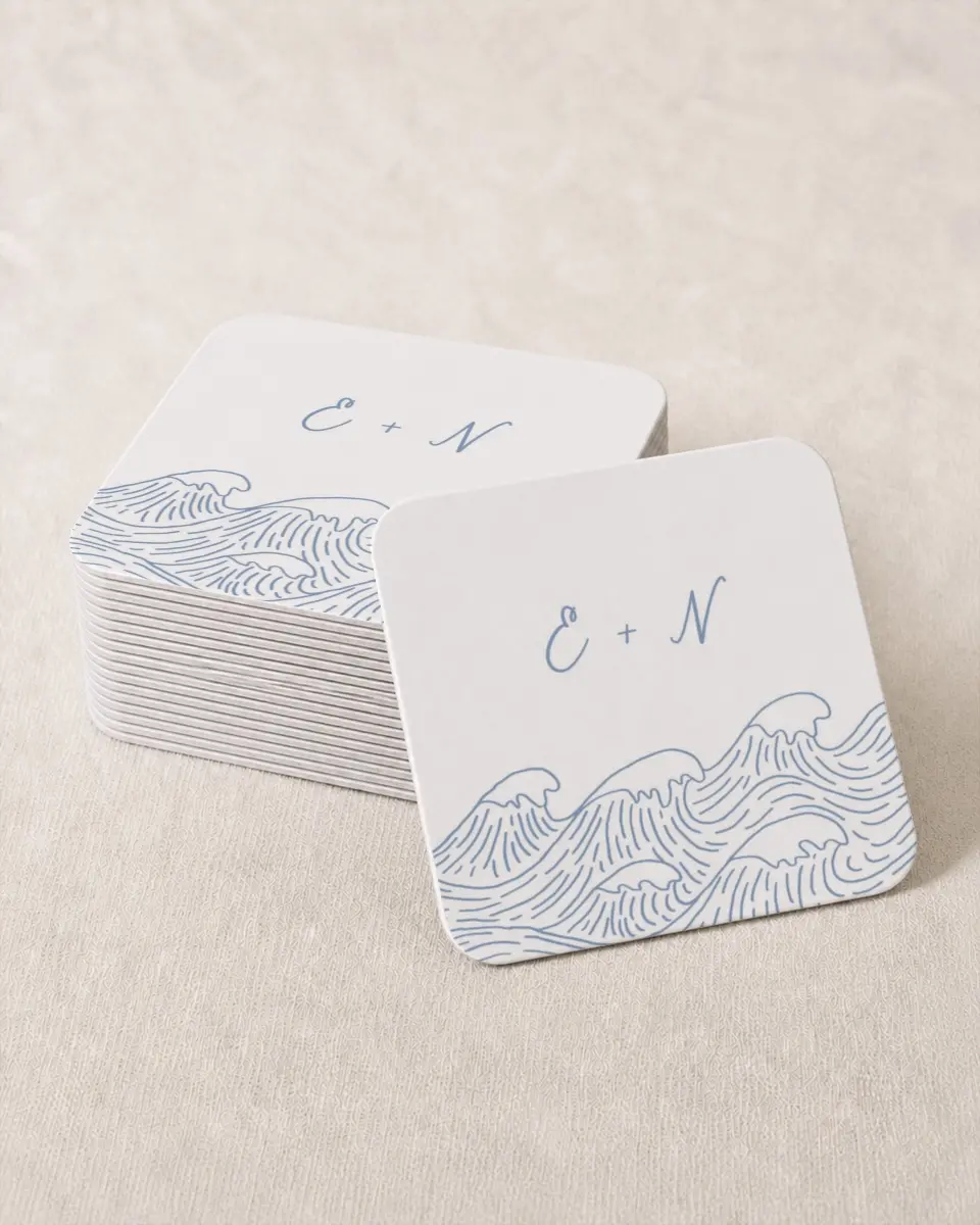 This is a 4" x 4" Wedding Coaster called Wave of Love printed in full color with Rose Gold foil on Kraft Chipboard paper