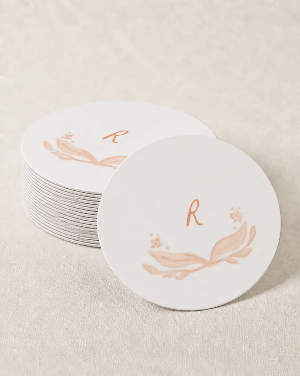 This is a 4" x 4" Wedding Coaster called Ever After Blooms printed in full color with Gold foil on Kraft Chipboard paper