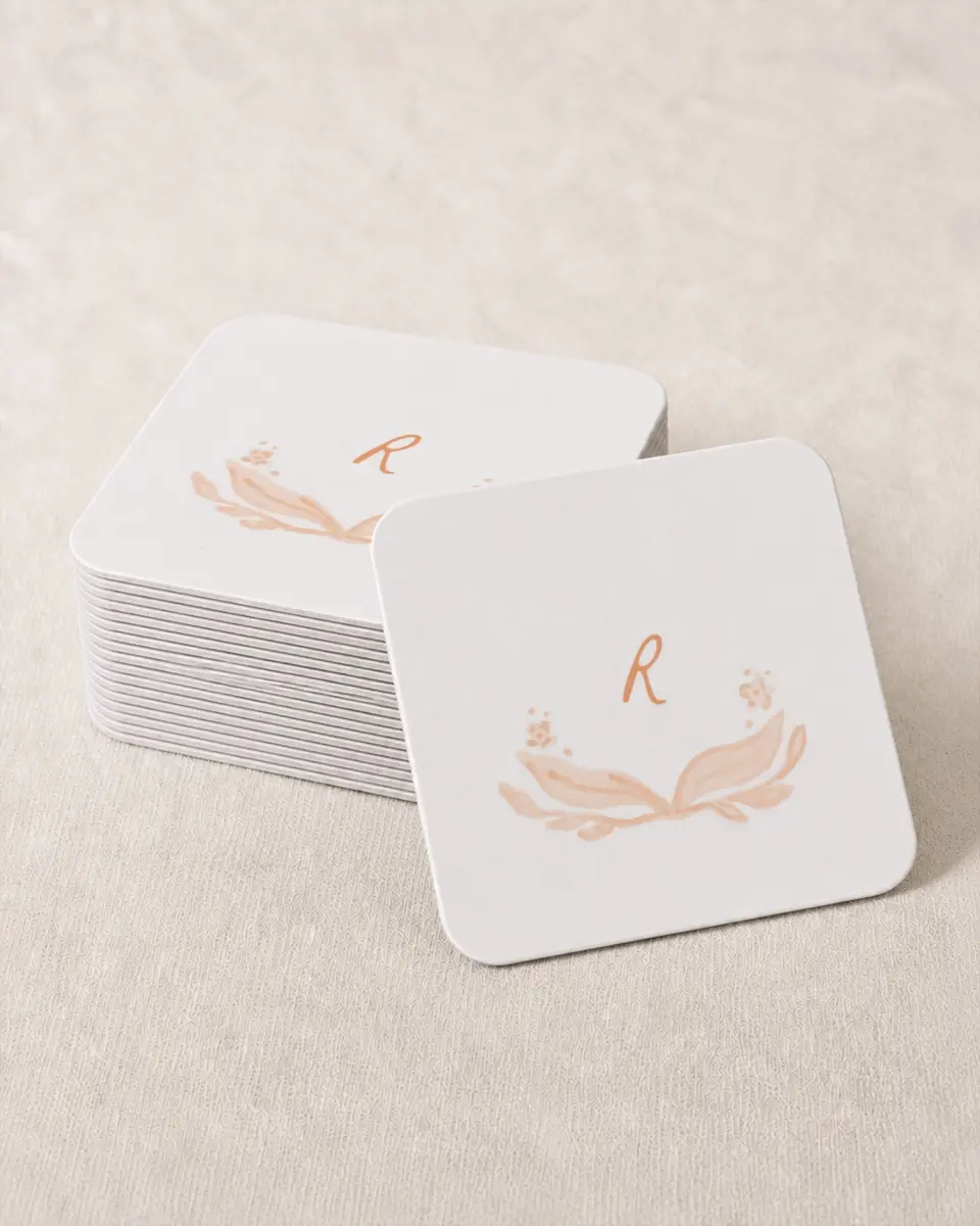 This is a 4" x 4" Wedding Coaster called Ever After Blooms printed in full color with Gold foil on Kraft Chipboard paper