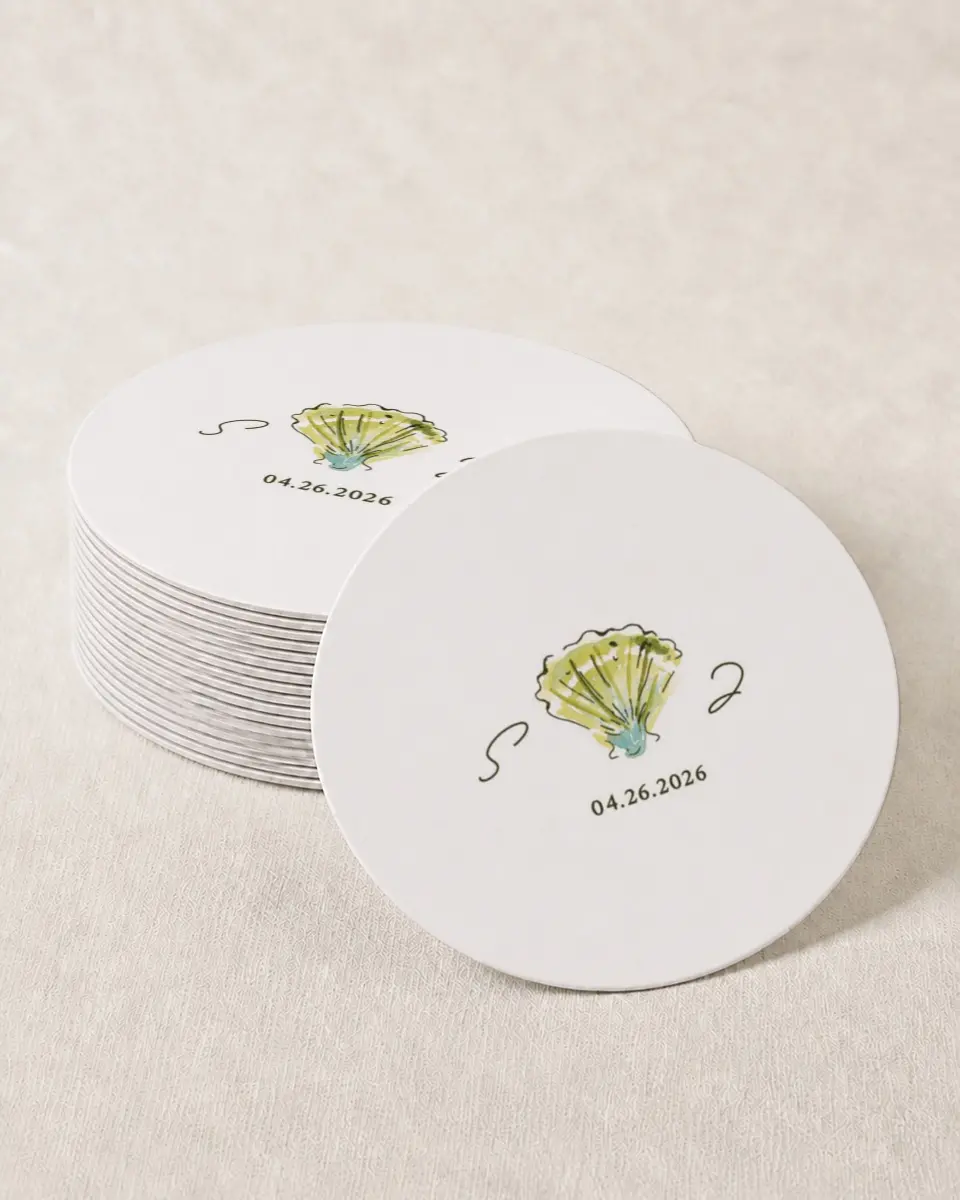 This is a 4" x 4" Wedding Coaster called Whimsical Shells printed in full color with Gold foil on Kraft Chipboard paper