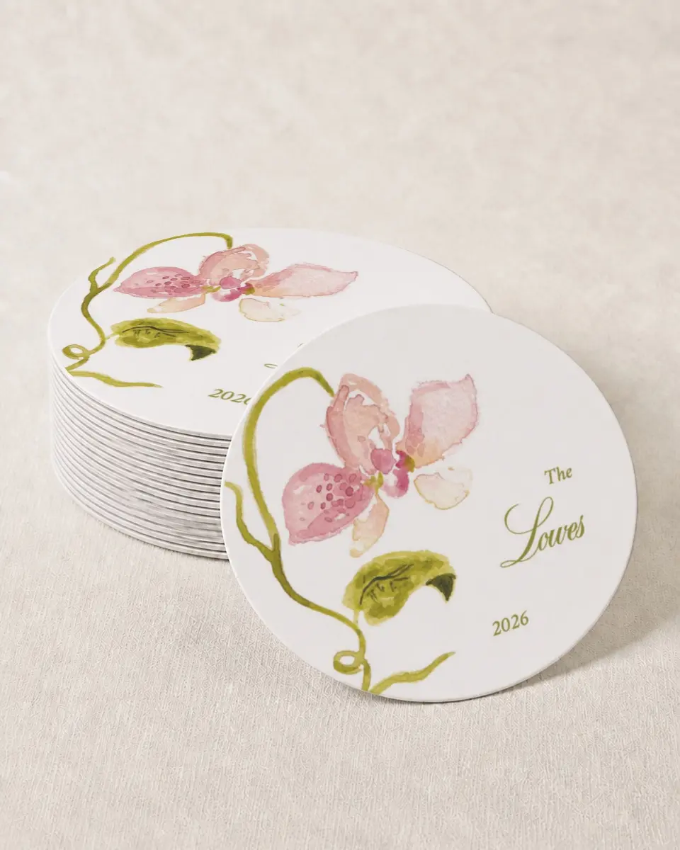 This is a 4" x 4" Wedding Coaster called Paradise in Bloom printed in full color with Gold foil on Kraft Chipboard paper