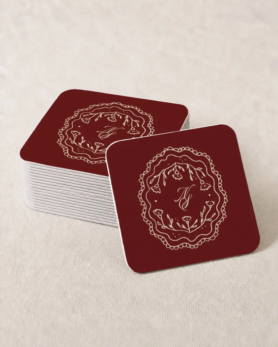 This is a 4" x 4" Wedding Coaster called Bloom & Crest printed in full color with Gold foil on Kraft Chipboard paper
