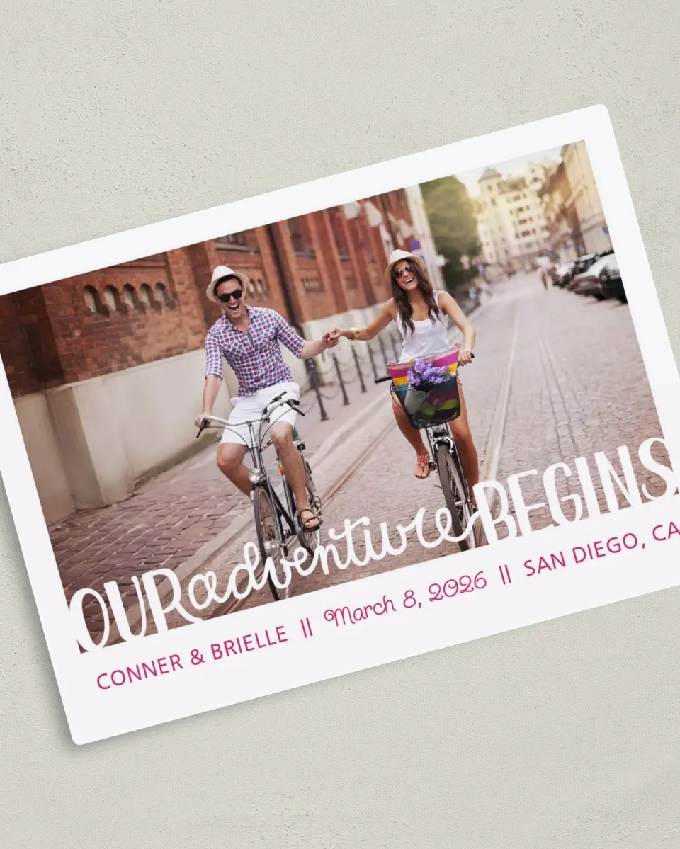 This is a 5" x 7" Save the Date Magnet called Our Adventure Begins printed in full color with a Luxe Satin finish