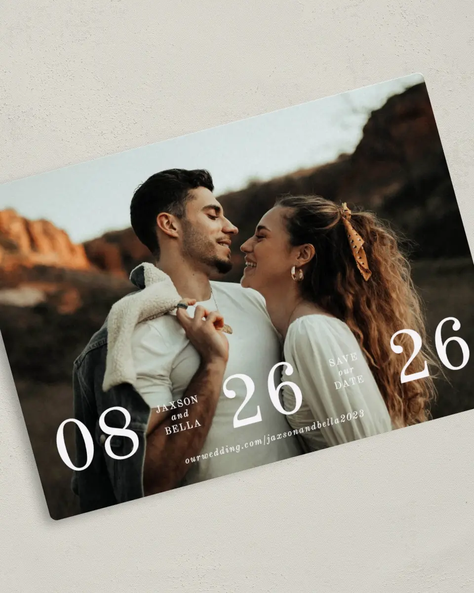 This is a 5" x 7" Save the Date Magnet called Immense Date printed in full color with Silver foil and a Luxe Satin finish