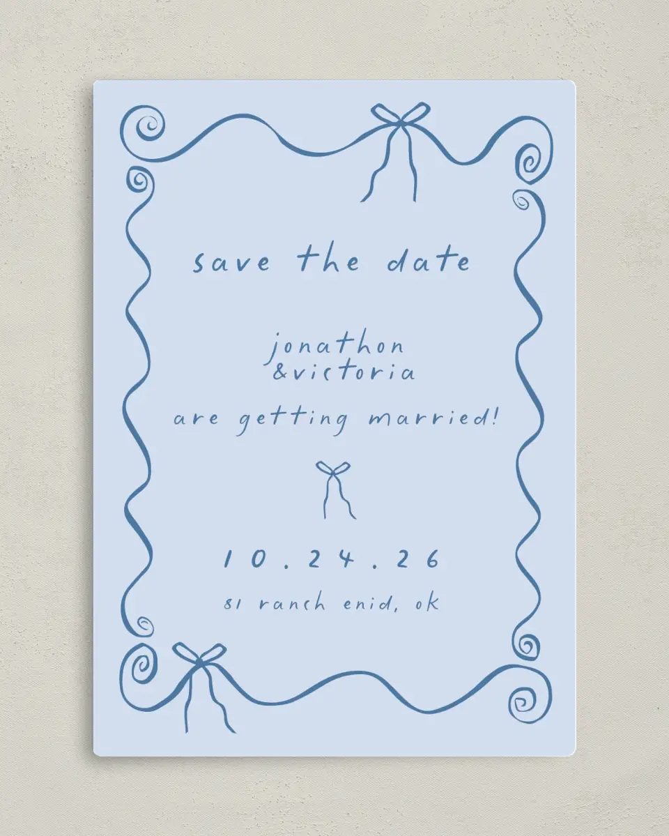 This is a 5" x 7" Save the Date Magnet called Ribbon Kisses printed in full color with a Luxe Satin finish