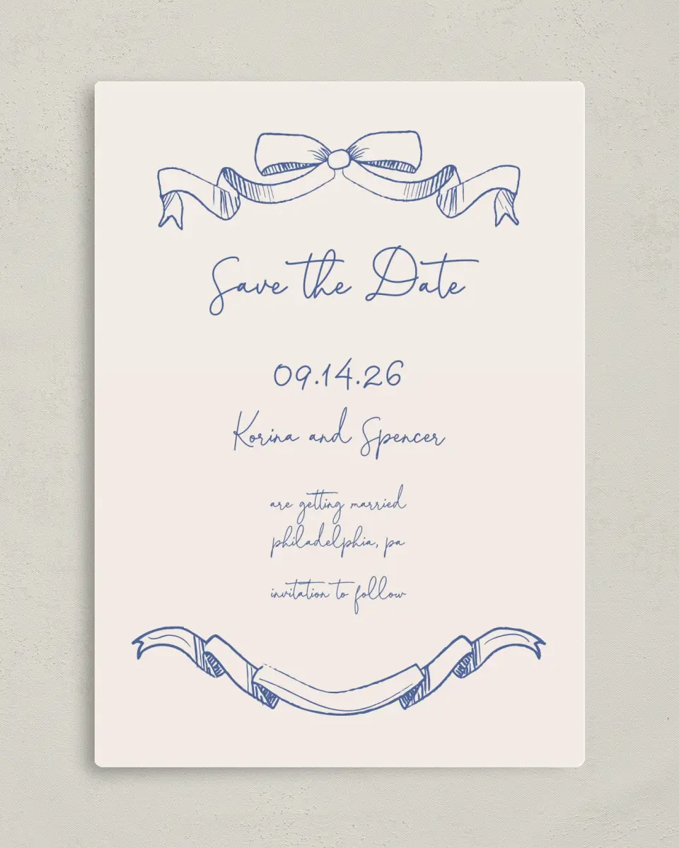 This is a 5" x 7" Save the Date Magnet called Sketched Bow printed in full color with a Luxe Satin finish