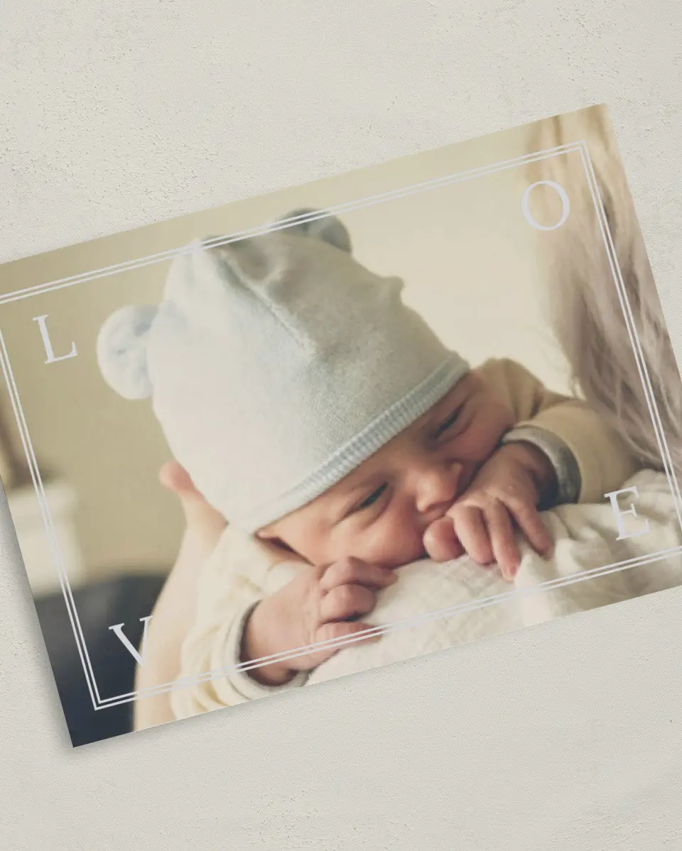 This is a 5" x 7" Birth Announcement Card called Love Framed printed in full color with Silver foil on Luxe Satin (coated) paper