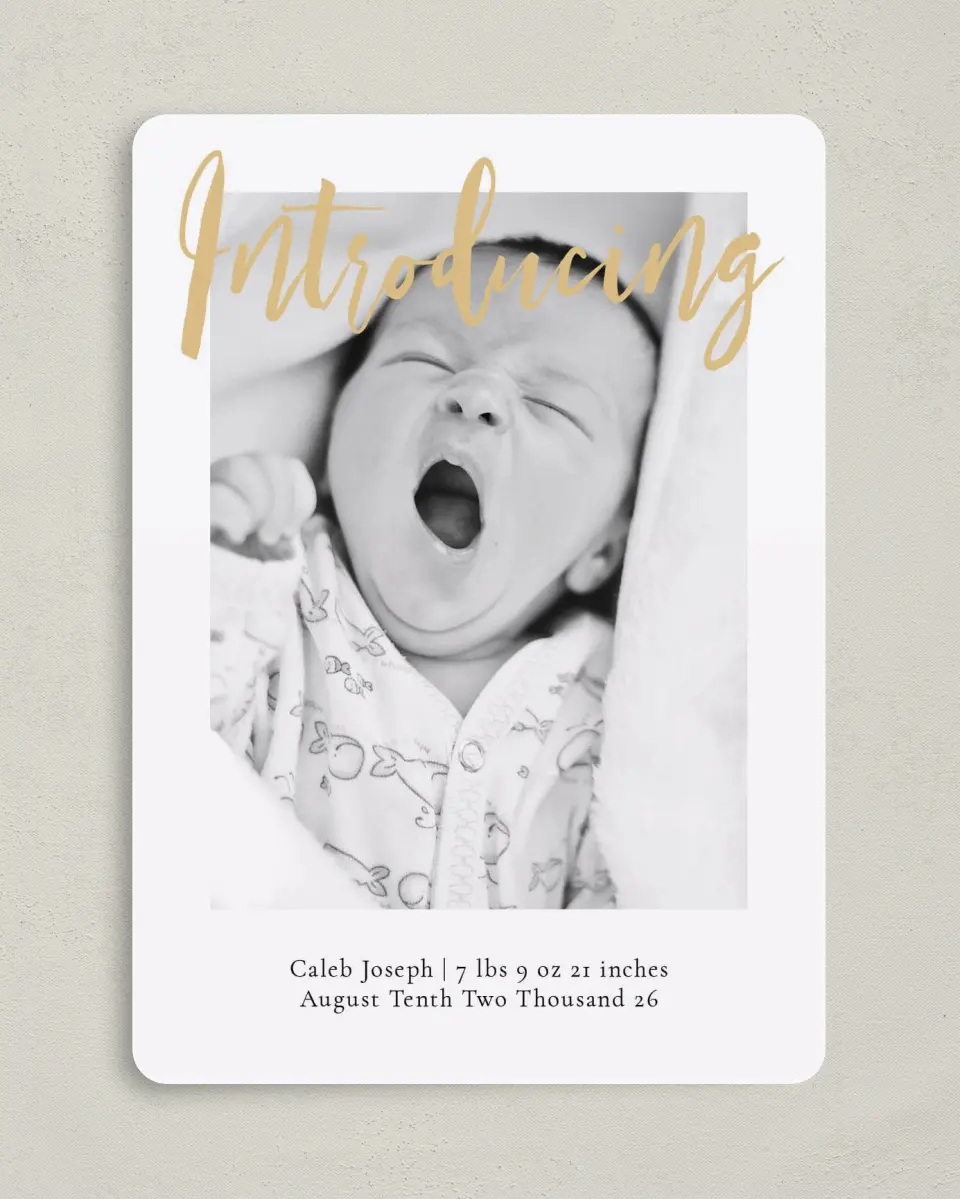 This is a 5" x 7" Birth Announcement Card called Glowing Intro printed in full color with Silver foil on Luxe Satin (coated) paper