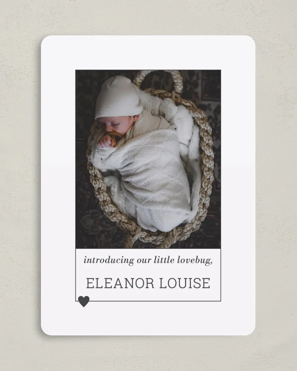 This is a 5" x 7" Birth Announcement Card called Heart of Love printed in full color with Silver foil on Luxe Satin (coated) paper