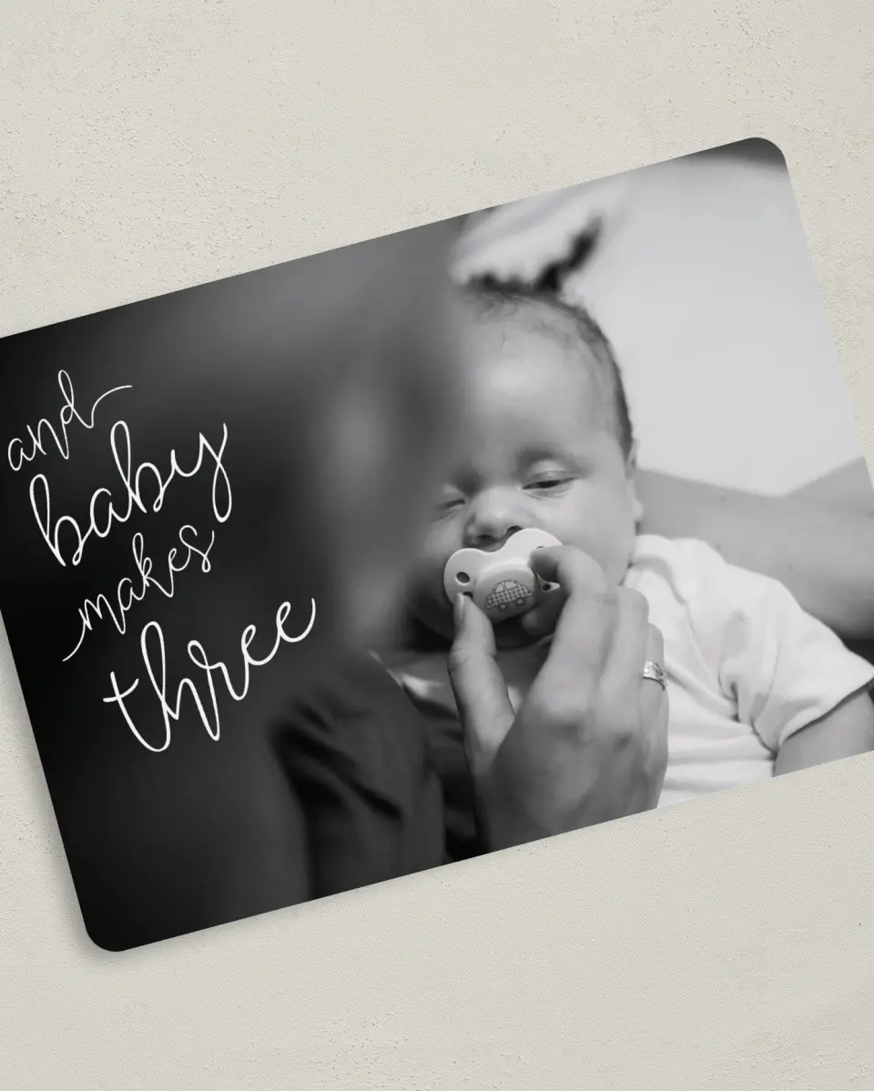 This is a 5" x 7" Birth Announcement Card called Baby Makes Three printed in full color with Silver foil on Luxe Satin (coated) paper