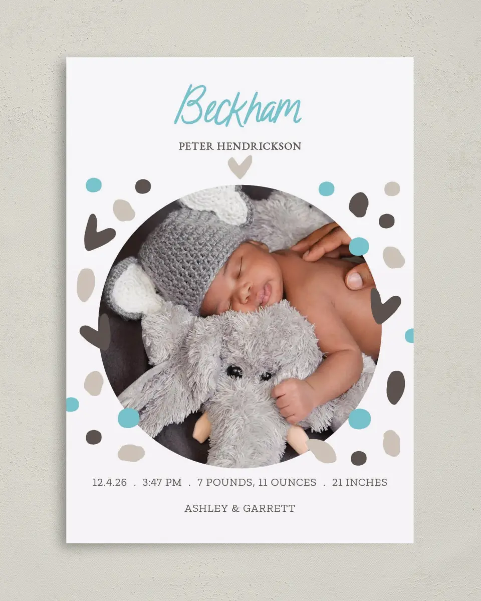 This is a 5" x 7" Birth Announcement Card called Confetti Hearts printed in full color with Silver foil on Luxe Satin (coated) paper
