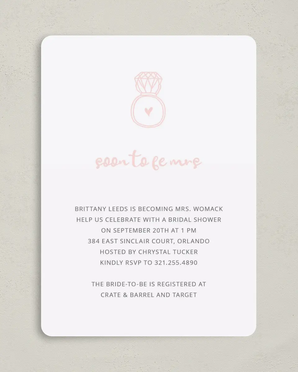 This is a 5" x 7" Bridal Shower Invitation called Ringing Heart printed in full color with Rose Gold foil on Luxe Satin (coated) paper