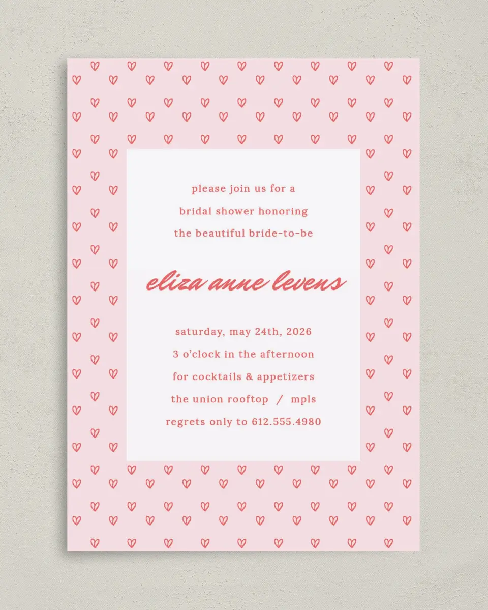 This is a 5" x 7" Bridal Shower Invitation called Hearts Aplenty printed in full color with Rose Gold foil on Luxe Satin (coated) paper