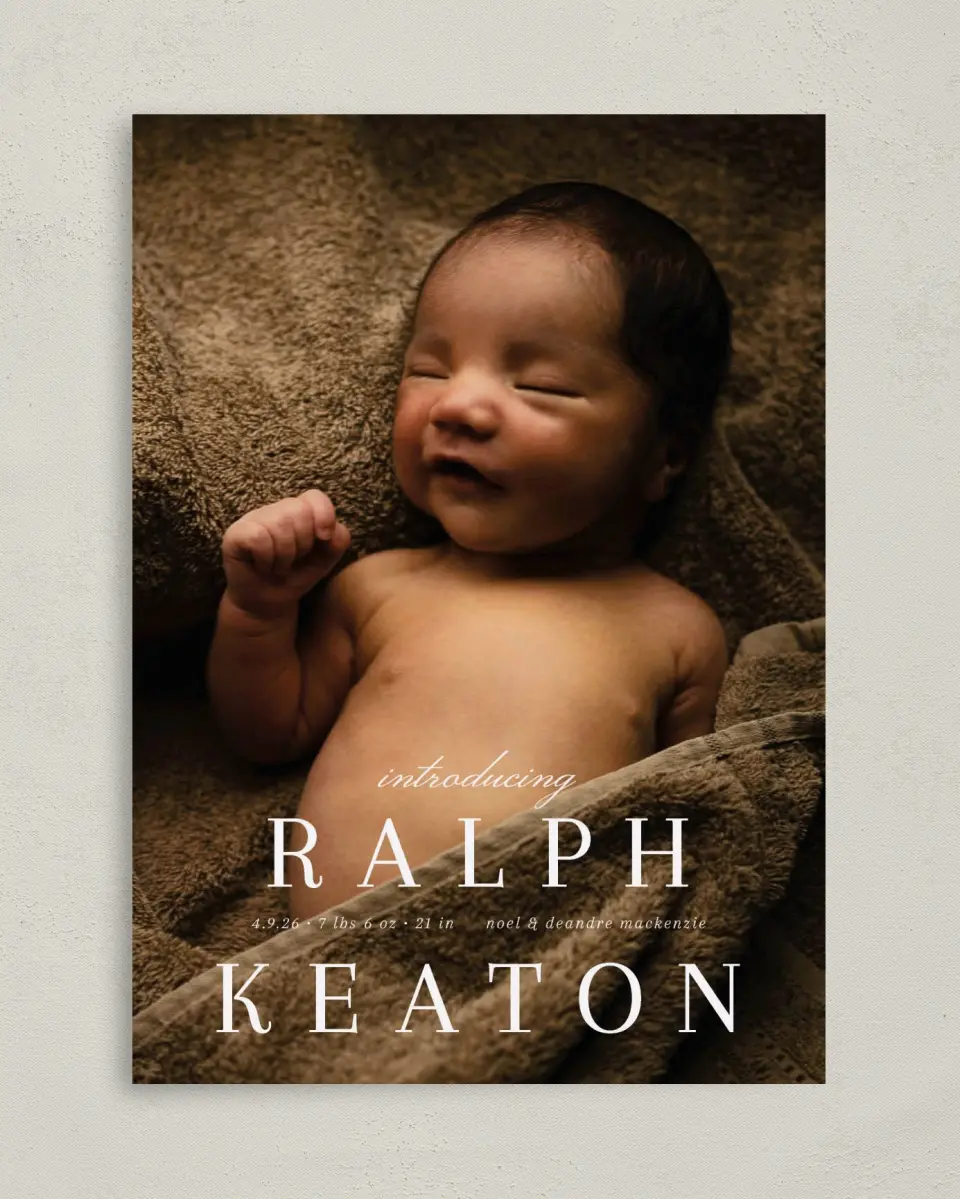 This is a 5" x 7" Birth Announcement Card called Proper Introduction printed in full color with Silver foil on Luxe Satin (coated) paper