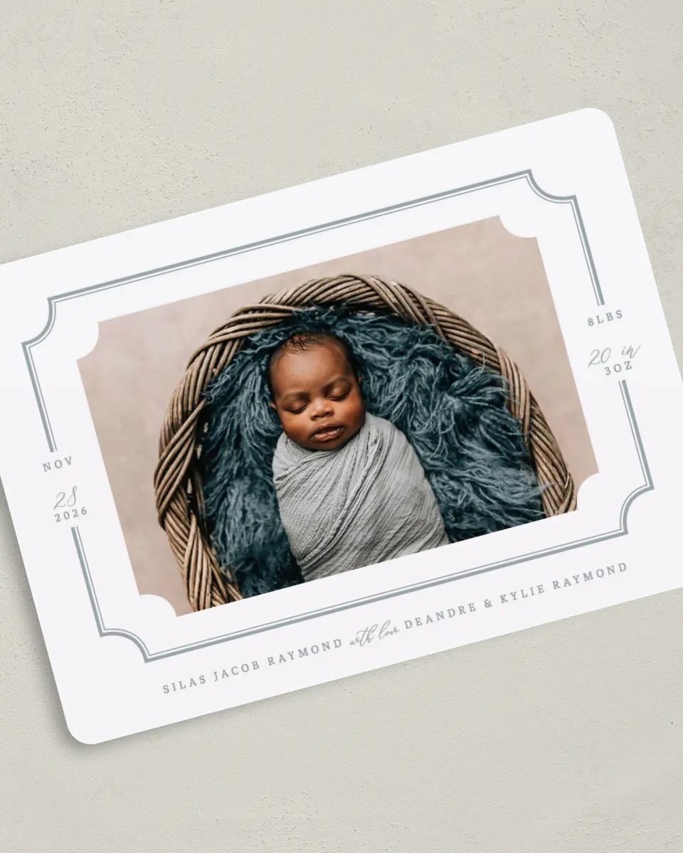This is a 5" x 7" Birth Announcement Card called Elegant Border printed in full color with Silver foil on Luxe Satin (coated) paper