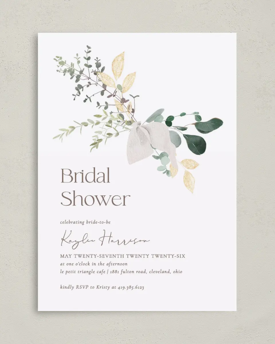 This is a 5" x 7" Bridal Shower Invitation called Botanical Bow printed in full color with Rose Gold foil on Luxe Satin (coated) paper