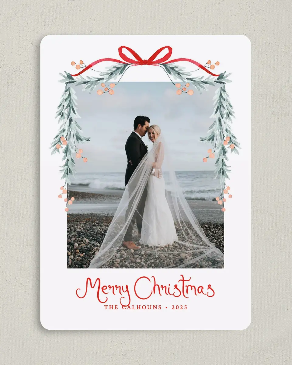 This is a 5" x 7" Christmas Card called Blushing Bow printed in full color with Silver foil on Soft Suede (coated) paper