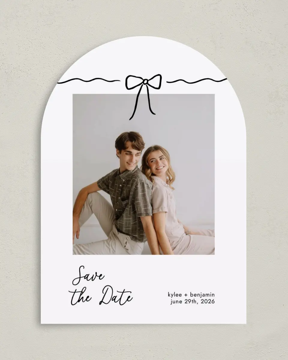 This is a 5" x 7" Arch Save the Date called Bows and Bliss printed in full color on Premium Smooth paper