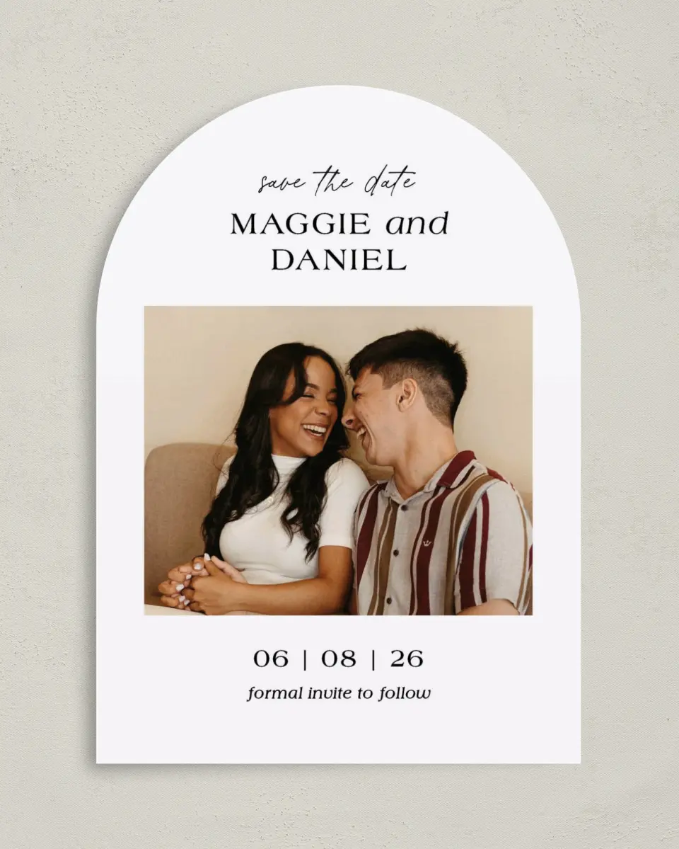 This is a 5" x 7" Arch Save the Date called Silly Romance printed in full color with Rose Gold foil on Luxe Satin paper