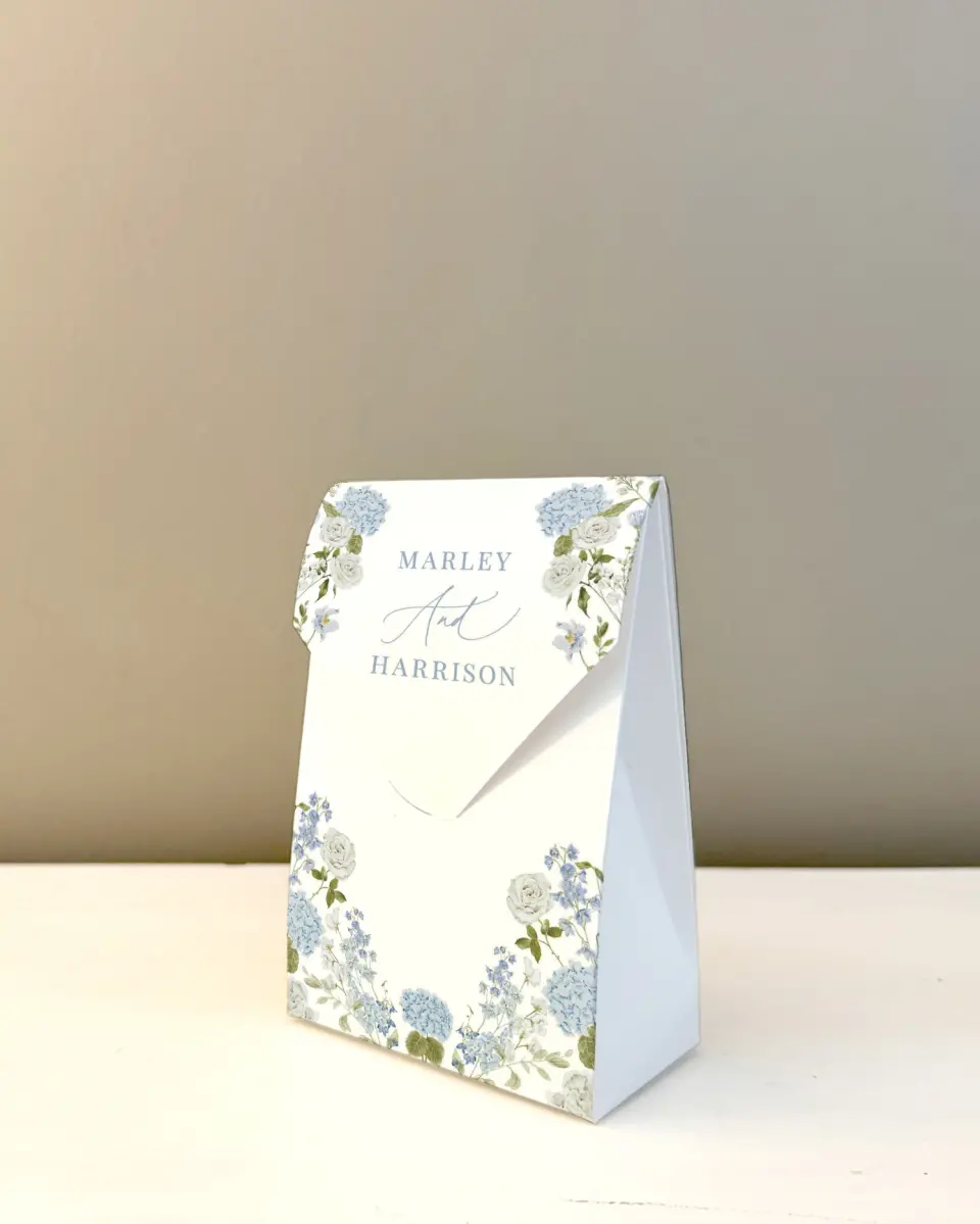 This is a 3.5" x 5.5" Wedding Favor Boxe called Blue Blossoms printed in full color with Gold foil