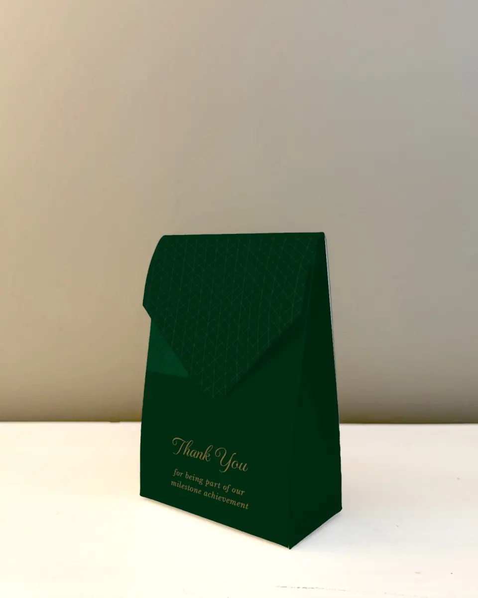 This is a 3.5" x 5.5" Business Favor Boxe called Enduring Evergreen printed in full color with Rose Gold foil