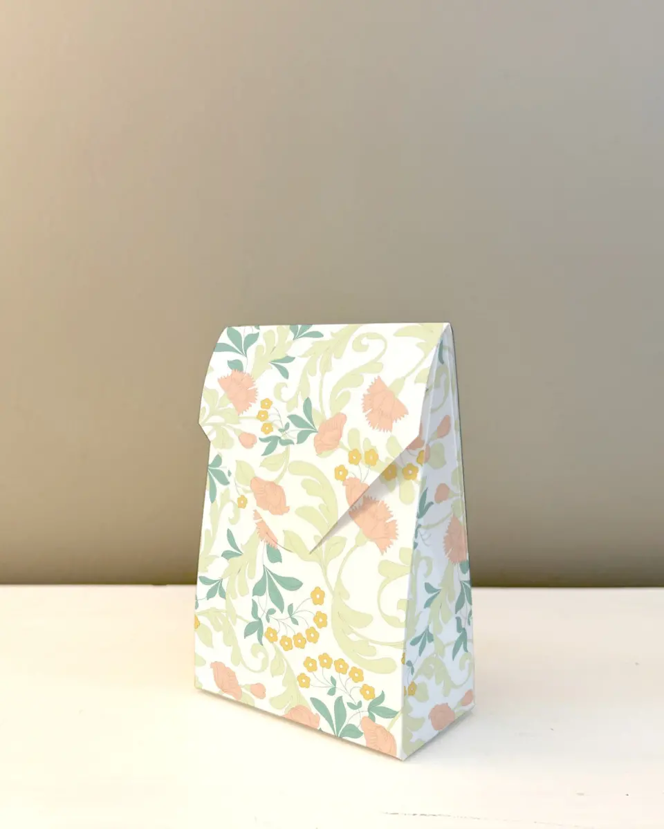 This is a 3.5" x 5.5" Business Favor Boxe called Ornate Charm printed in full color with Rose Gold foil