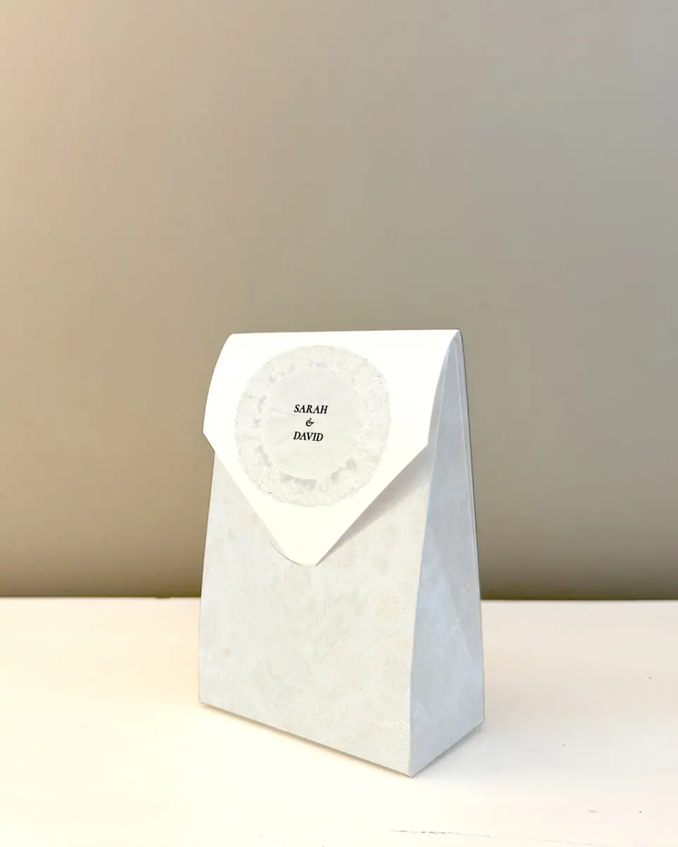 This is a 3.5" x 5.5" Wedding Favor Boxe called Trimmed Lace printed in full color with Silver foil