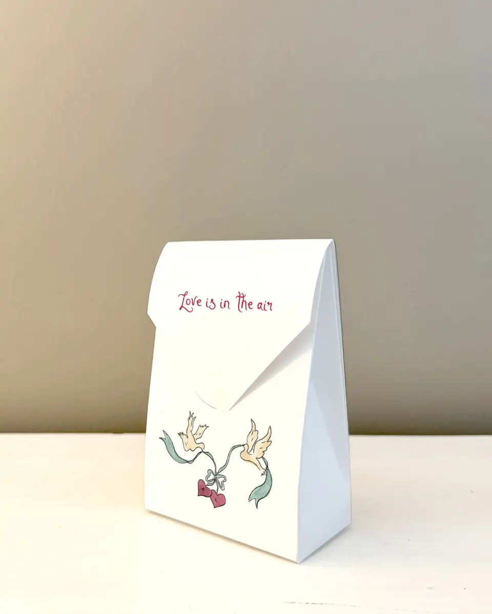 This is a 3.5" x 5.5" Wedding Favor Boxe called Love Dove printed in full color with Rose Gold foil