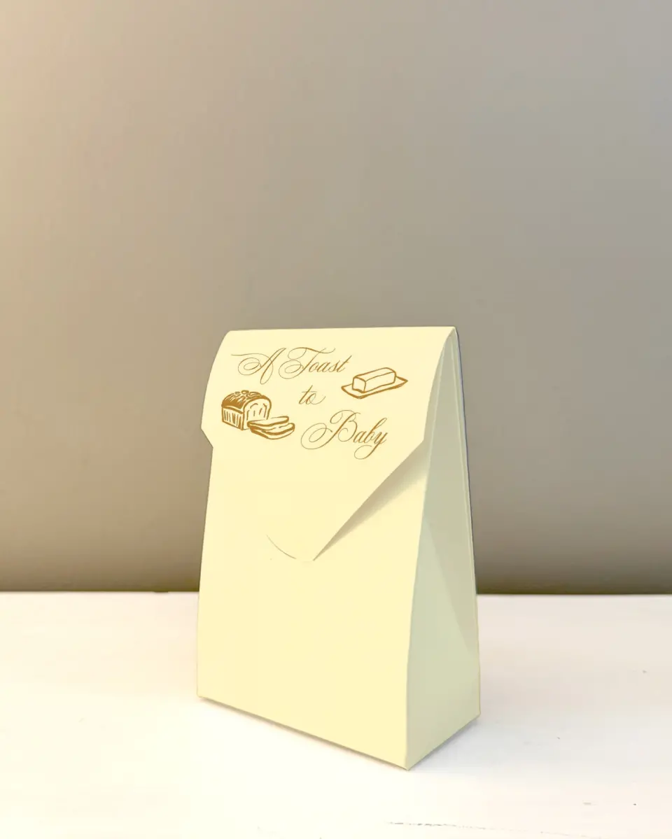 This is a 3.5" x 5.5" Wedding Favor Boxe called Toast to Baby printed in full color with Gold foil