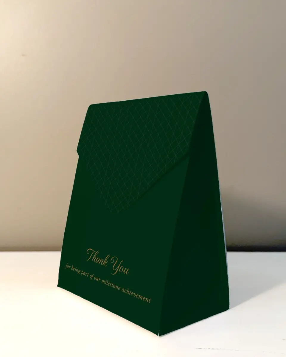 This is a 5" x 7" Business Favor Boxe called Enduring Evergreen printed in full color with Rose Gold foil