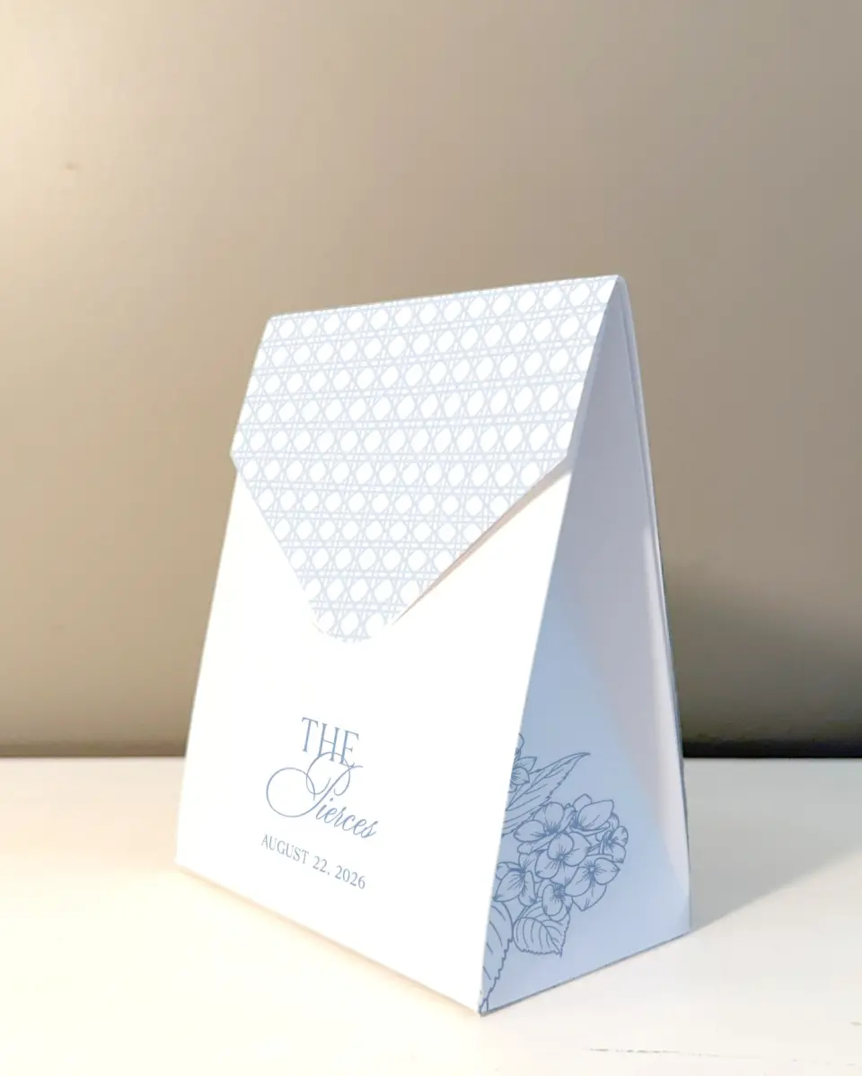 This is a 5" x 7" Wedding Favor Boxe called Woven Serenity printed in full color with Rose Gold foil