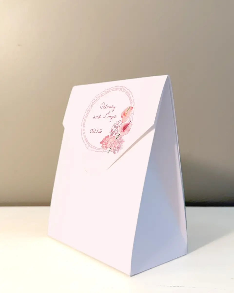 This is a 5" x 7" Wedding Favor Boxe called Blushing Whimsy printed in full color with Rose Gold foil