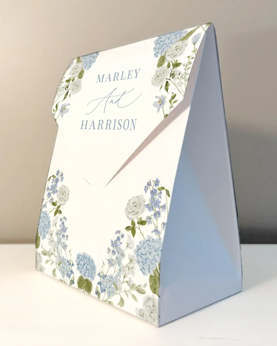 This is a 6.5" x 9" Wedding Favor Boxe called Blue Blossoms printed in full color with Rose Gold foil