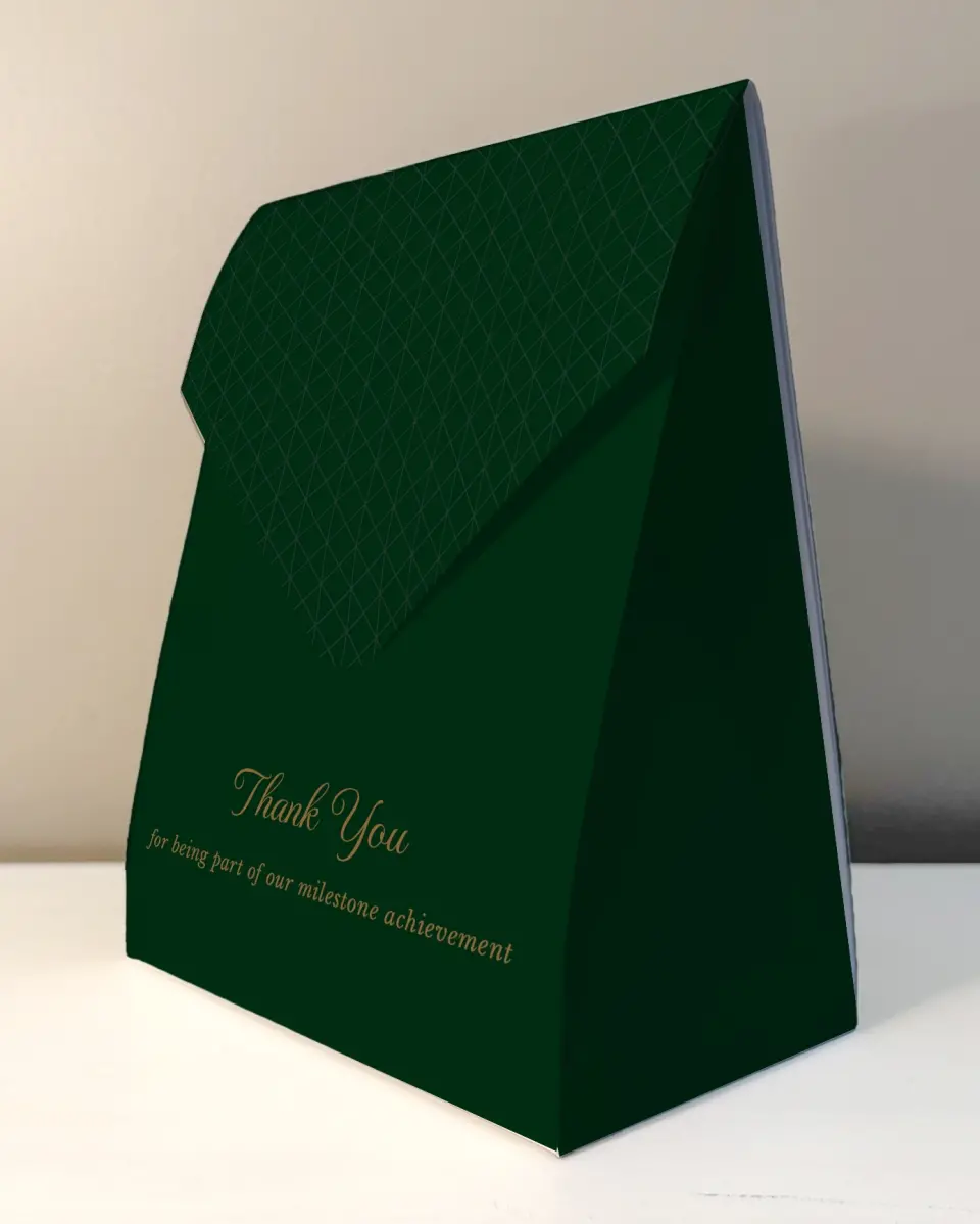 This is a 6.5" x 9" Business Favor Boxe called Enduring Evergreen printed in full color with Rose Gold foil