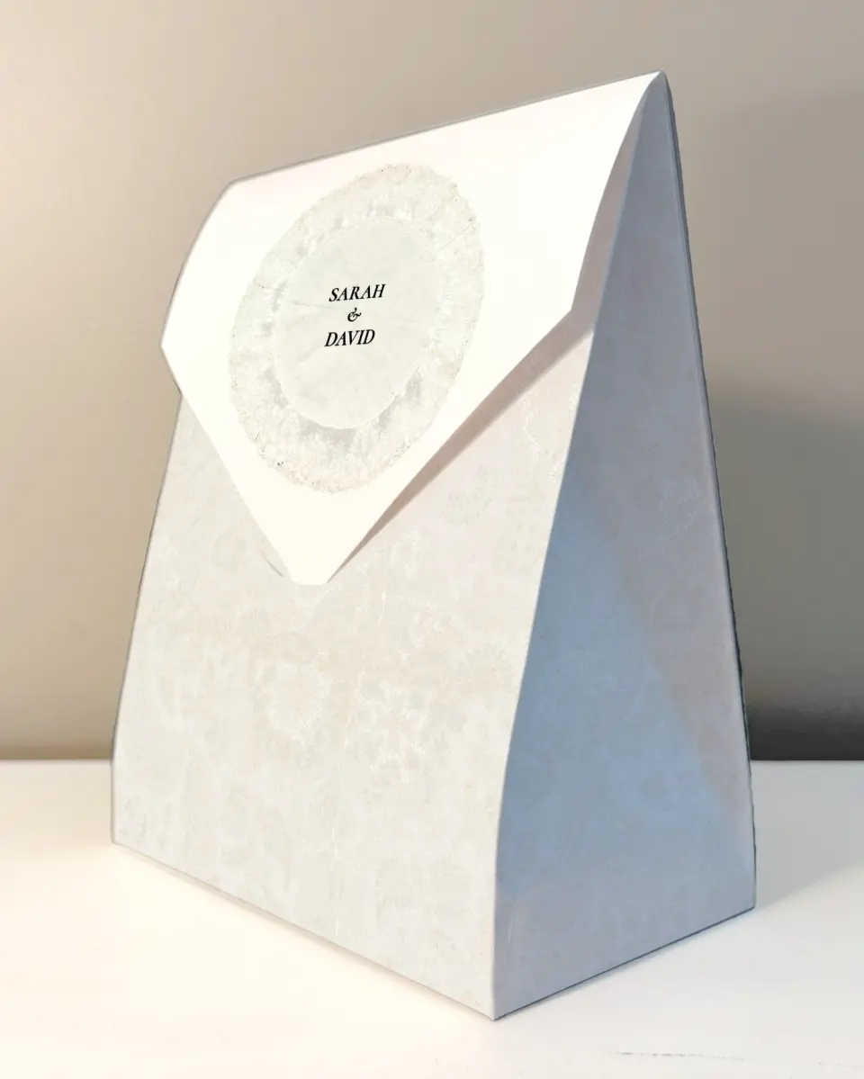This is a 6.5" x 9" Wedding Favor Boxe called Trimmed Lace printed in full color with Rose Gold foil