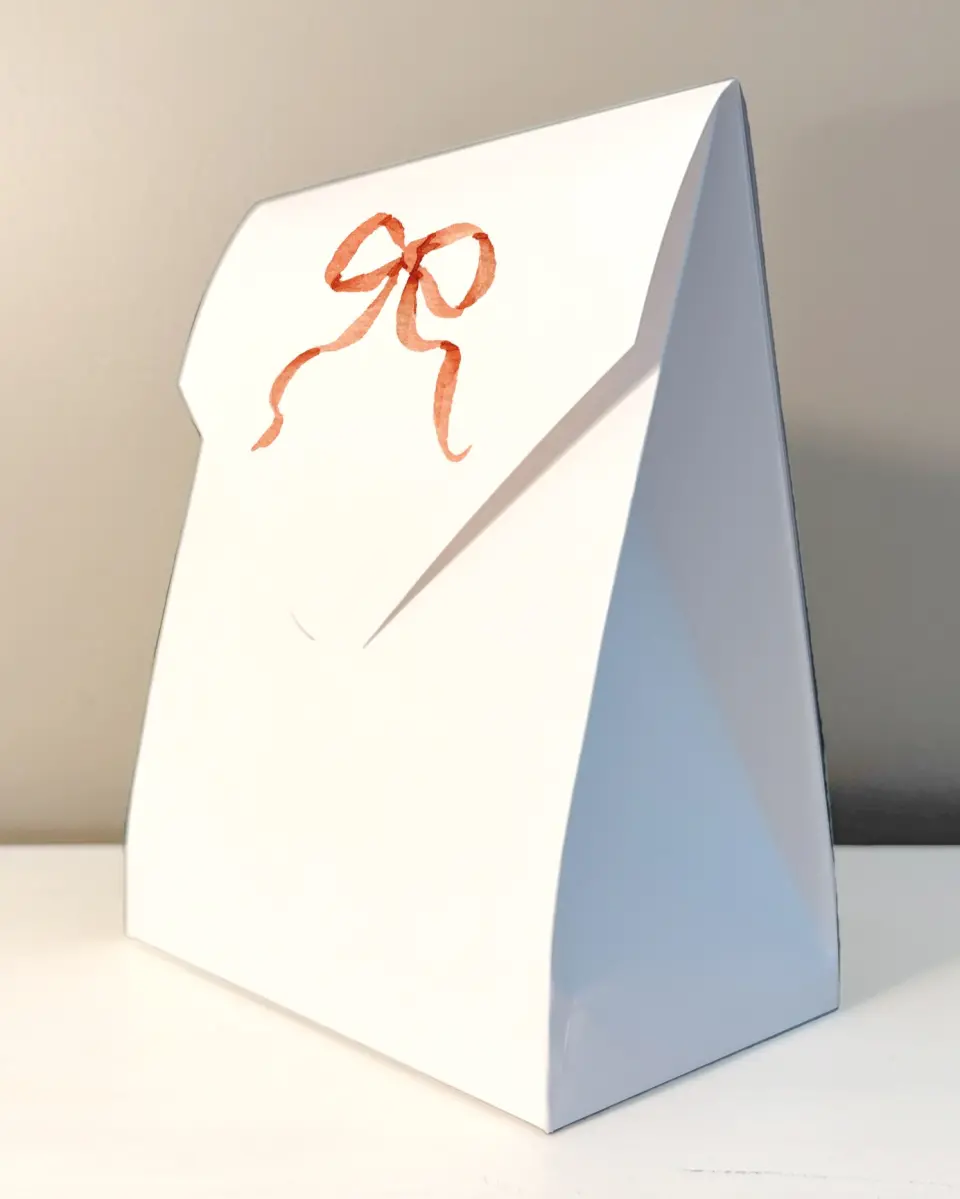 This is a 6.5" x 9" Wedding Favor Boxe called Festive Trimmings printed in full color with Rose Gold foil