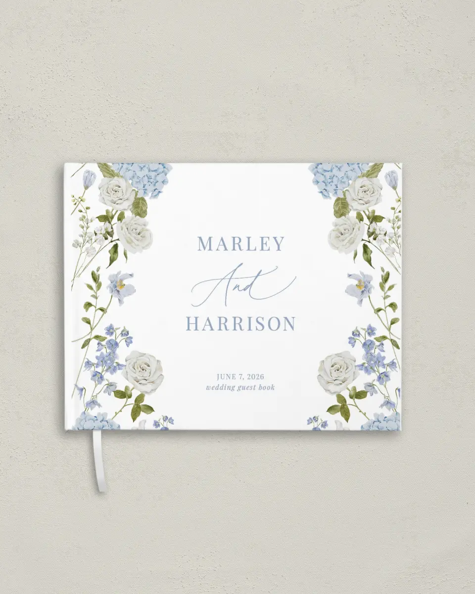 This is a 10½" x 8¼" Wedding Guest Book called Blue Blossoms printed in full color with Silver foil