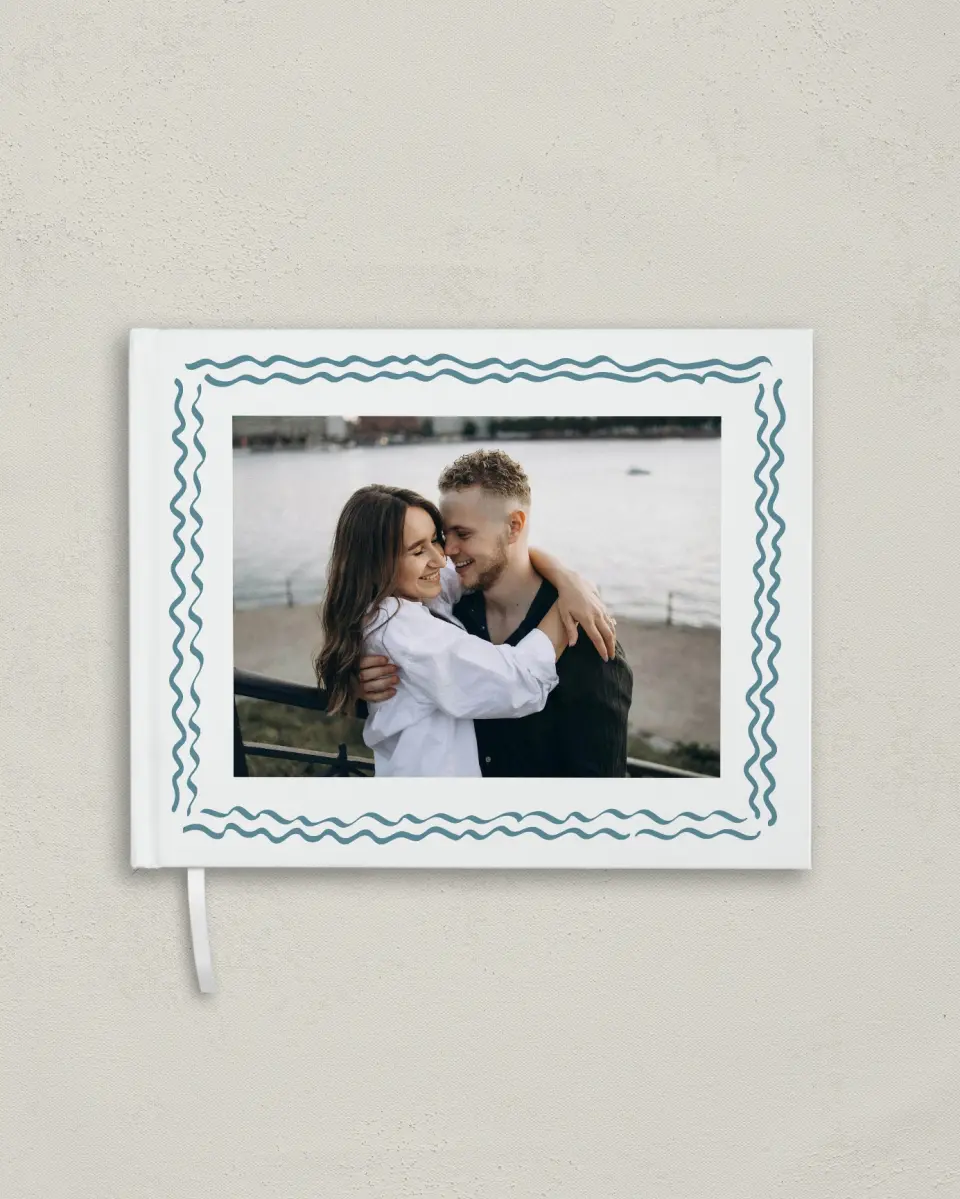 This is a 10½" x 8¼" Wedding Guest Book called I Hear Wedding Shells printed in full color