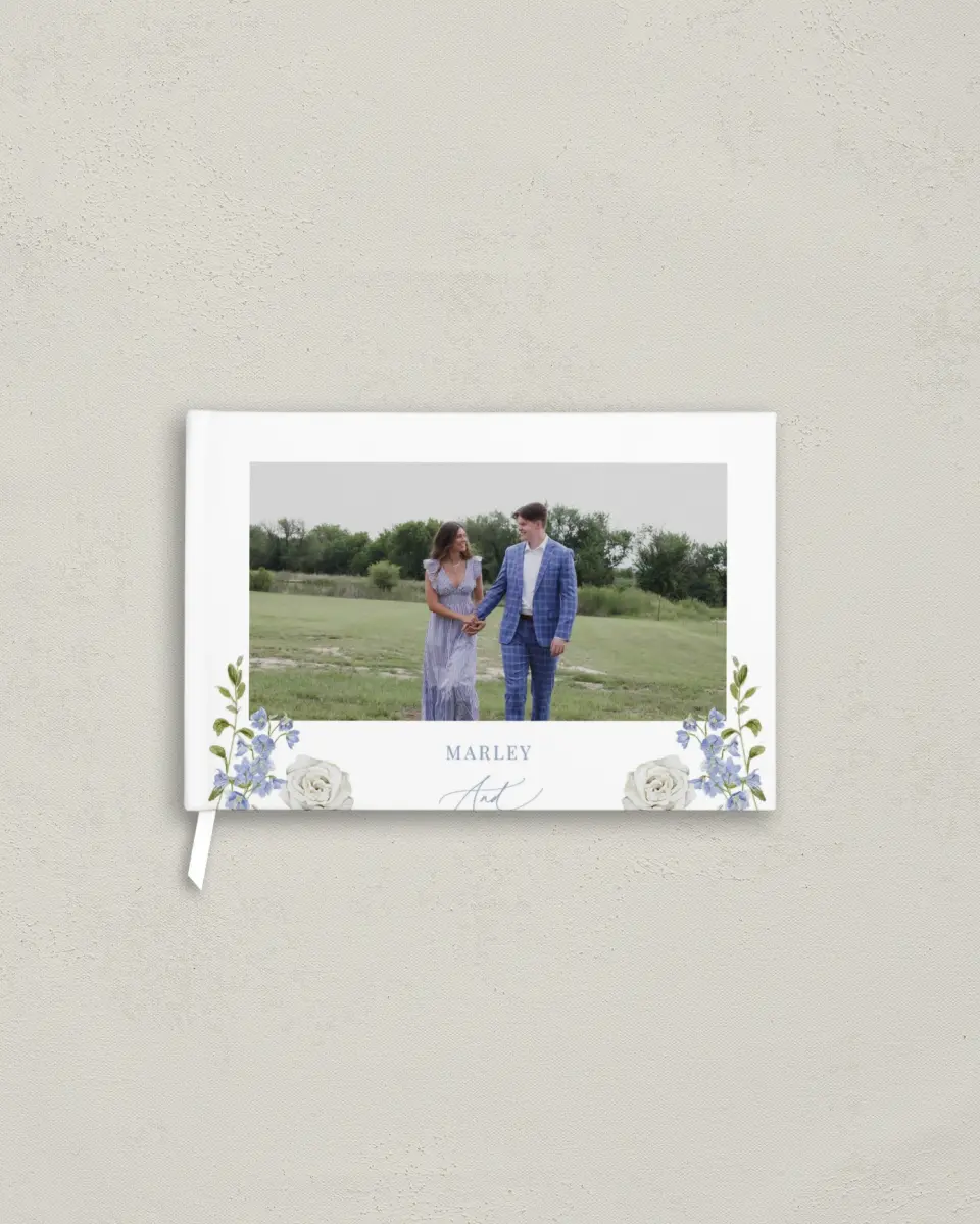 This is a 9" x 6" Wedding Guest Book called Blue Blossoms printed in full color with Silver foil