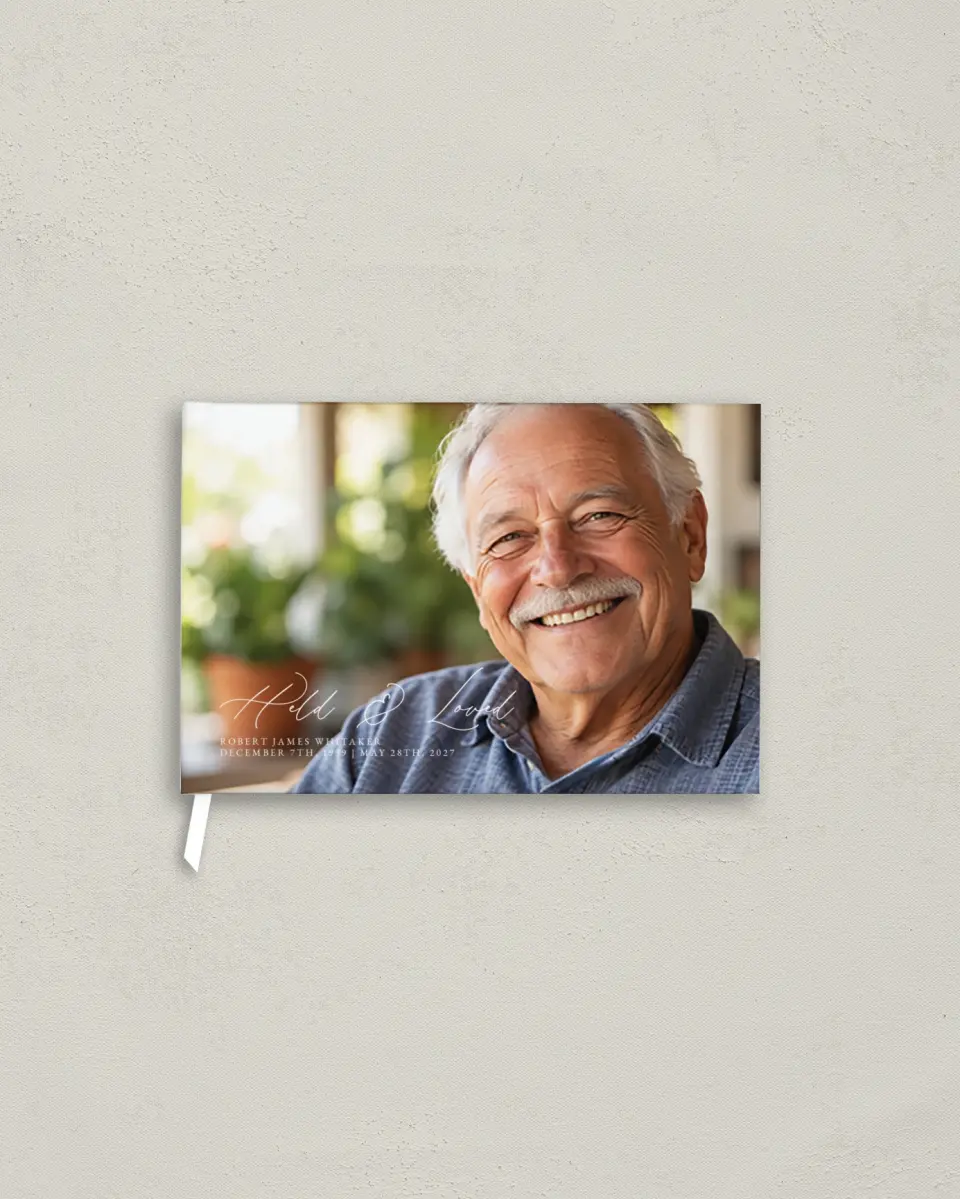 This is a 9" x 6" Memorial Guest Book called Held & Loved printed in full color