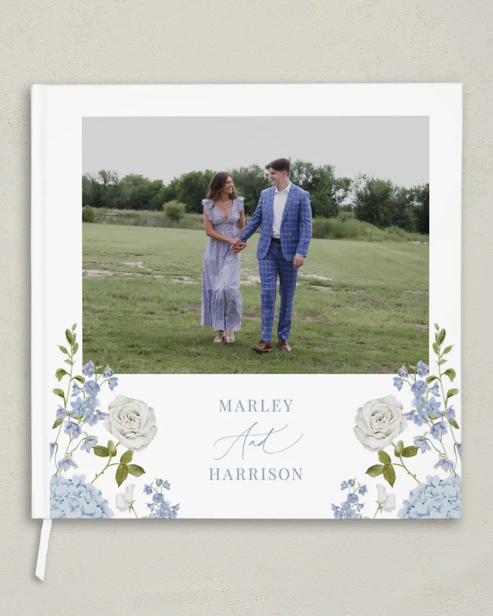 This is a 12" x 12" Wedding Guest Book called Blue Blossoms printed in full color with Gold foil