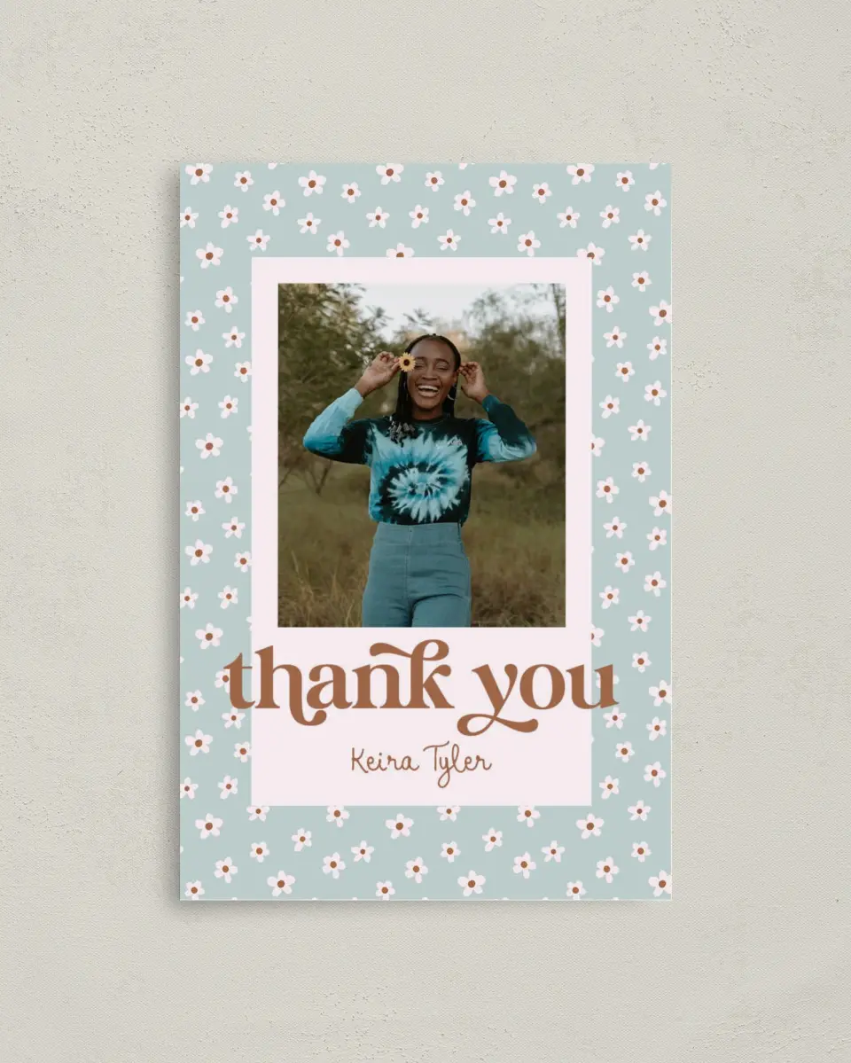 This is a 4" x 6" Folded Graduation Thank You Card called Demure Daisies printed in full color on Premium Smooth paper