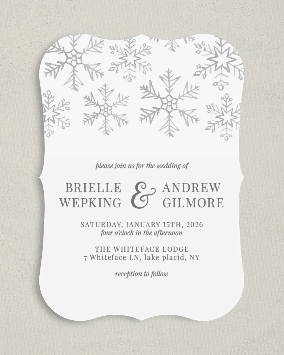 This is a 5" x 7" Bracket Wedding Invitation called Sweet Snowflakes printed in full color with Silver foil on Luxe Satin (coated) paper