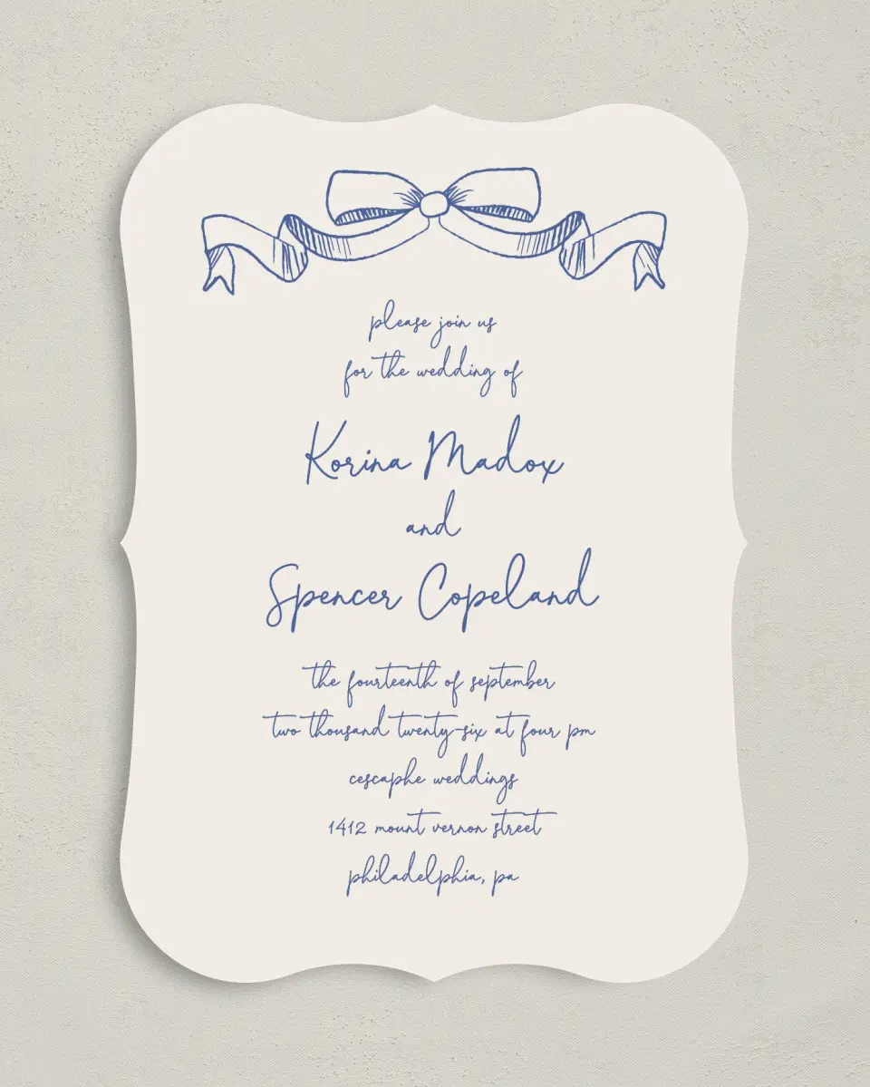 This is a 5" x 7" Bracket Wedding Invitation called Sketched Bow printed in full color with Silver foil on Luxe Satin (coated) paper