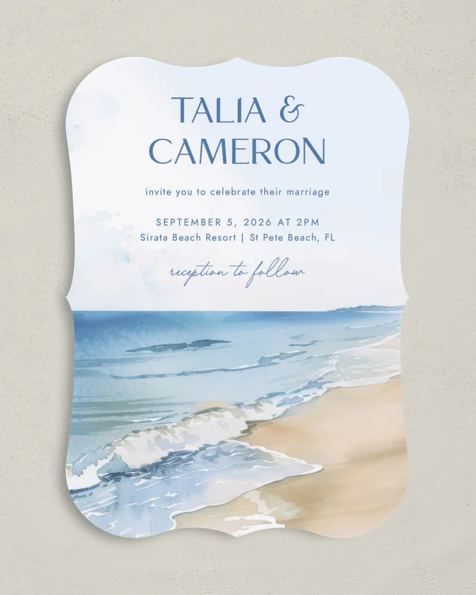 This is a 5" x 7" Bracket Wedding Invitation called Seaside Serenade printed in full color with Silver foil on Luxe Satin (coated) paper