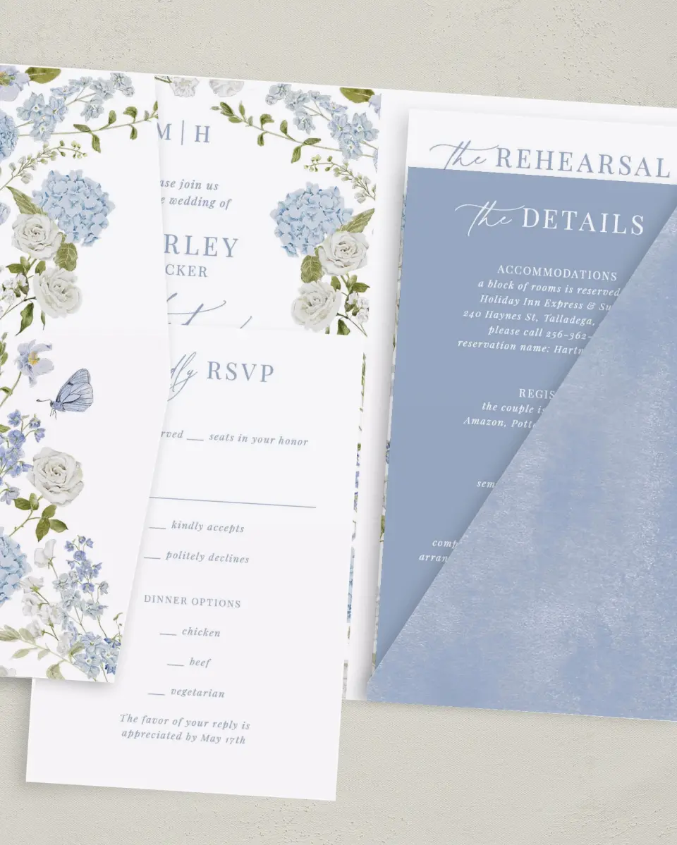 This is a 5" x 7⅞" Pocket Wedding Invitation called Blue Blossoms printed in full color with Gold foil on Luxe Satin (coated) paper