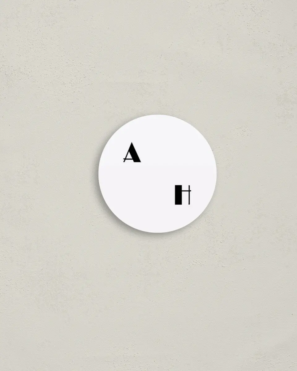 This is a 2" circle Envelope Seal called Modern Initial printed in full color