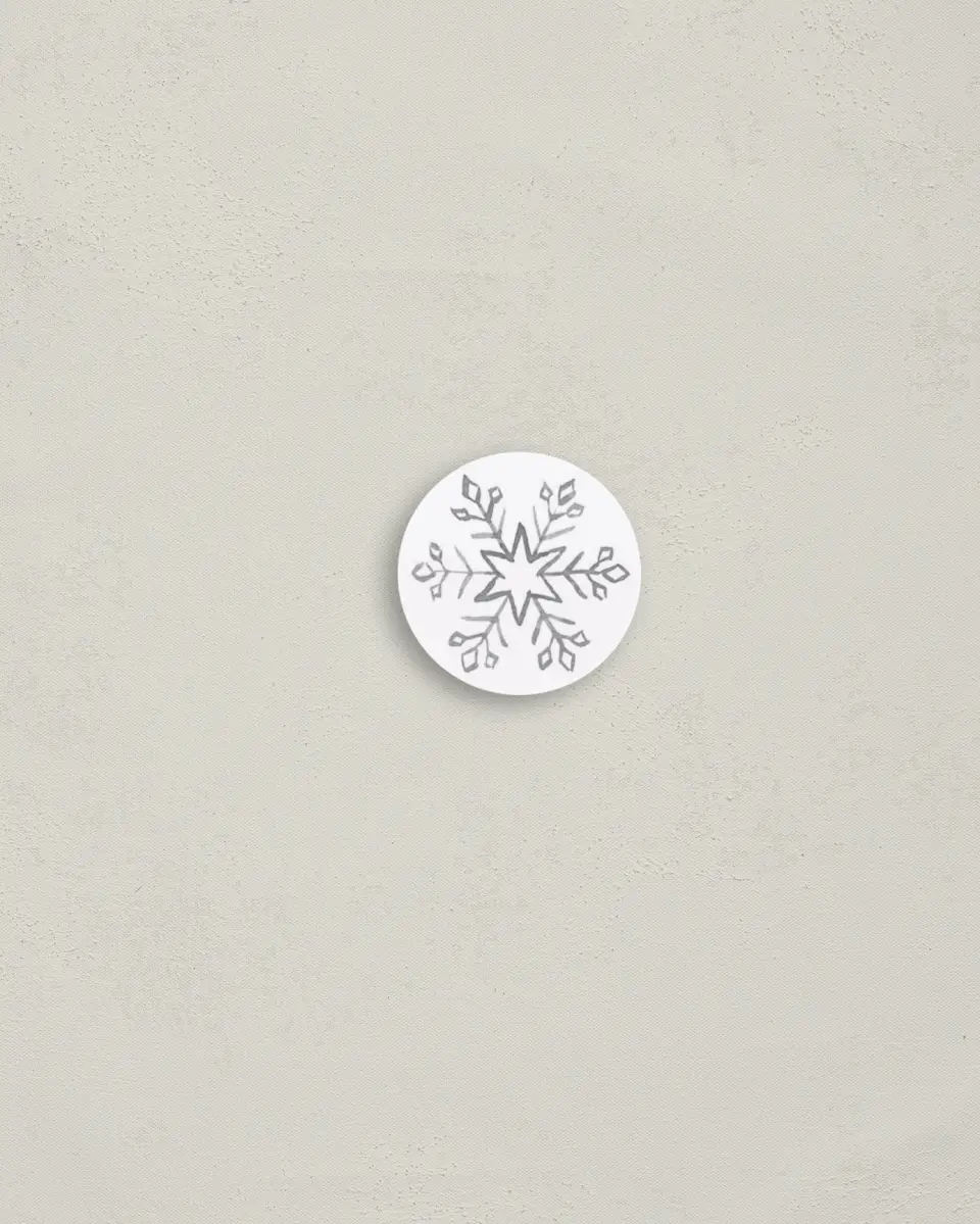 This is a 1¼" circle Envelope Seal called Snowflakes printed in full color
