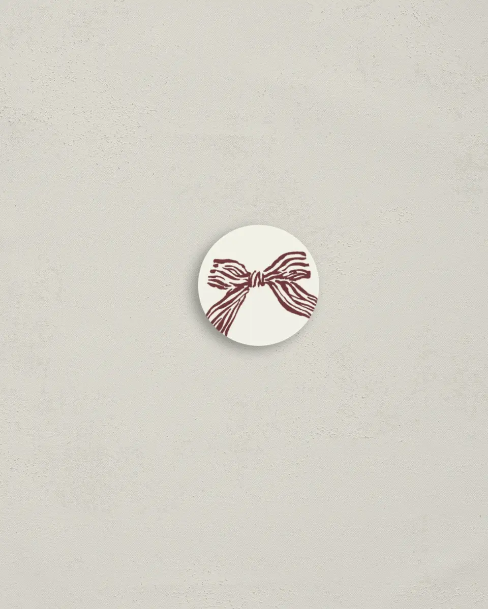 This is a 1¼" circle Envelope Seal called Bold Bow printed in full color
