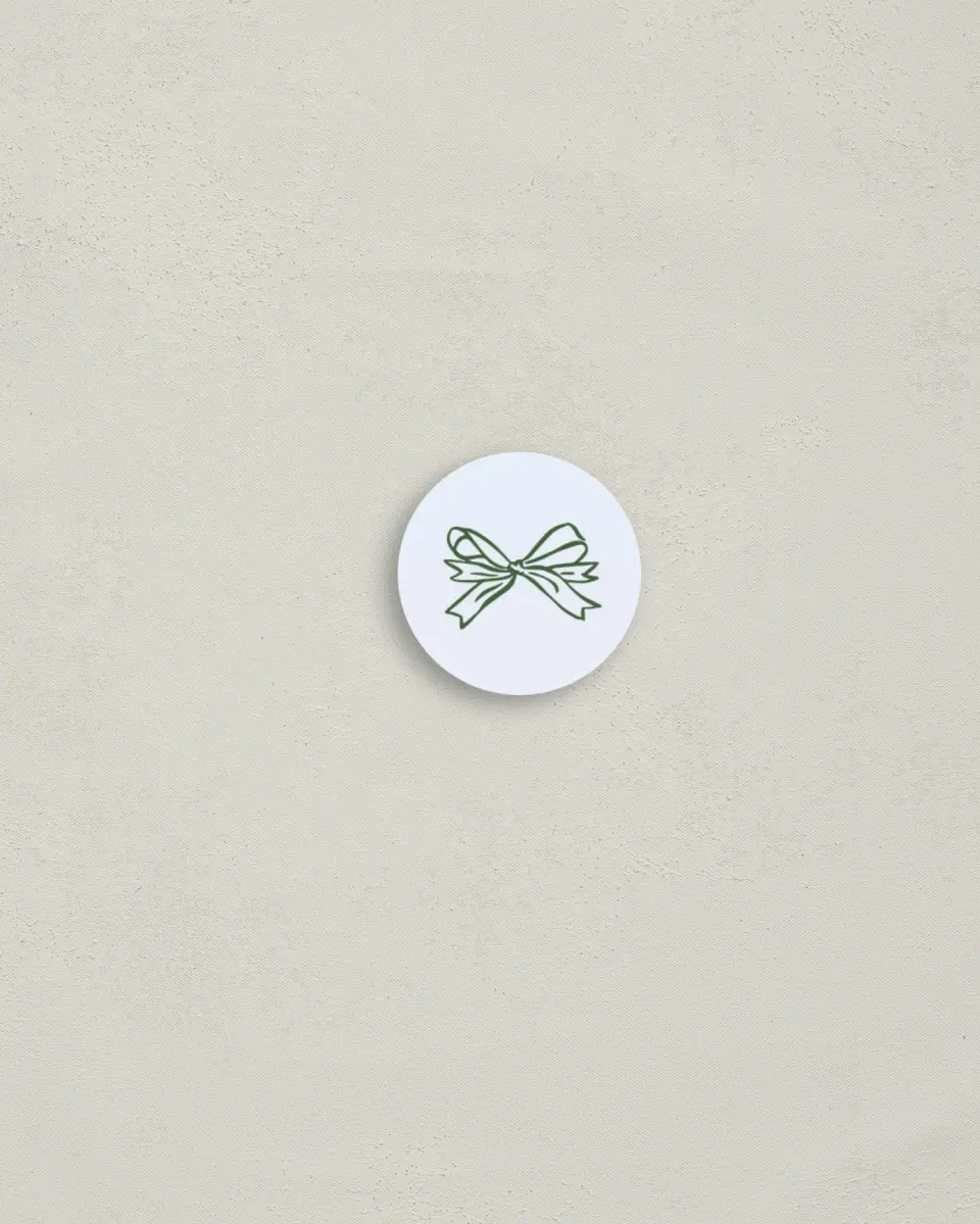 This is a 1¼" circle Envelope Seal called Wrapped in Firsts printed in full color